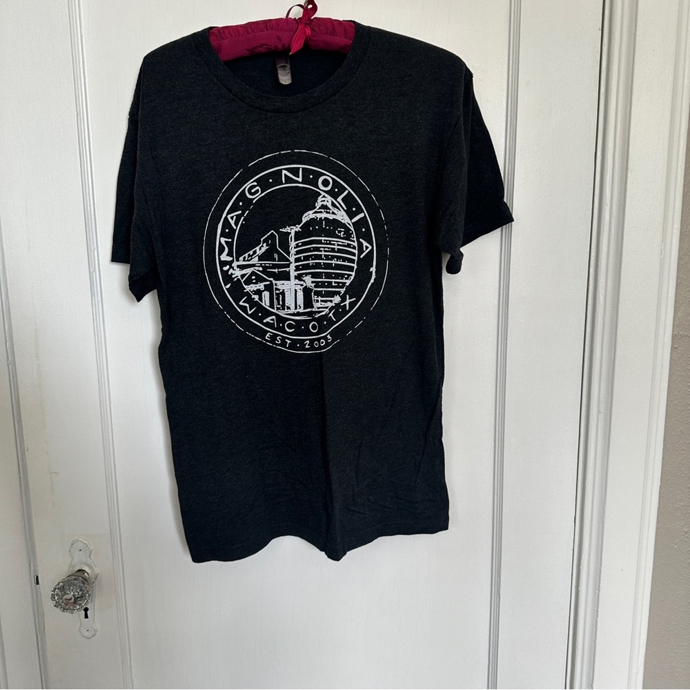 Magnolia, Waco Texas size small t-shirt. Dark gray color. Soft and comfortable.